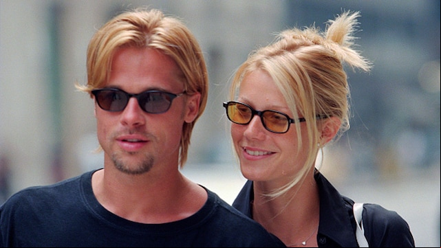 Plano medio de Brad Pitt y Gwyneth Paltrow paseando juntos en 1996