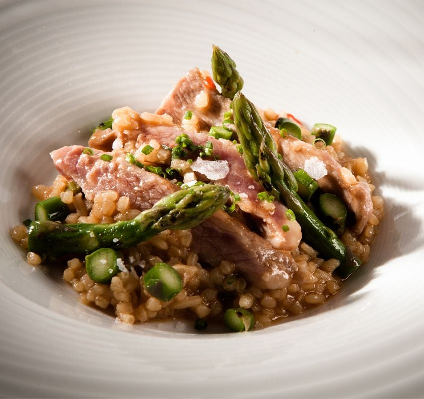 Secreto de bellota ibérico con arroz meloso de trigueros