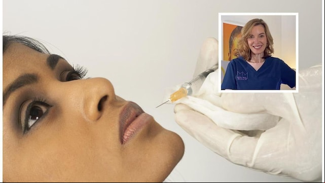 Doctor injecting collagen into young womans lip