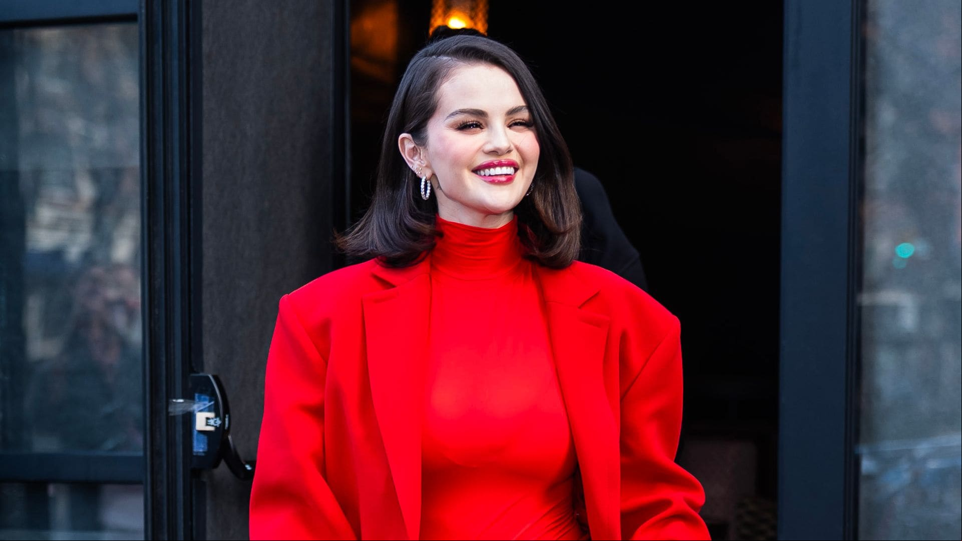 Selena Gomez shows off her figure in timeless dress and soft glam makeup look
