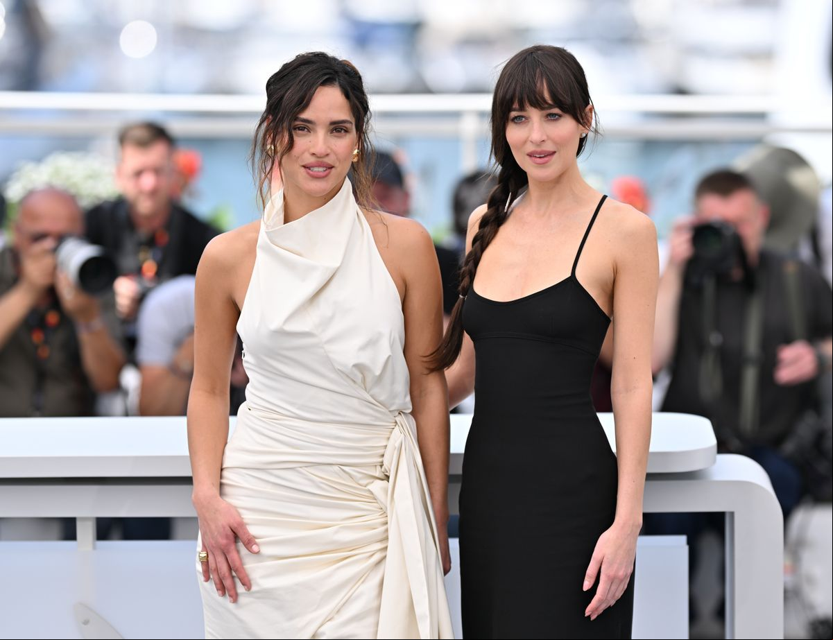 Adria Arjona (L) US actress Dakota Johnson (R) pose during a photocall for the film 'Splitsville' at the 78th edition of the Cannes Film Festival in Cannes,  on May 19, 2025. 